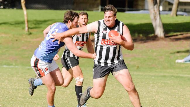 Nick Jolly, pictured with the ball, was best for Norwood Payneham Union in its clash with Prince Alfred Old Collegians on Saturday. Picture: AAP/Morgan Sette