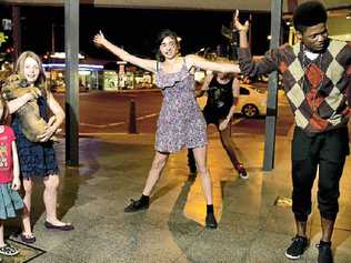 BREAK OUT: Kiyua Performing Arts flash mob crew (from left) Caitlin Webb, Rhiannon Williams, Frodo the dog, Breanna Lee and Franck Monsembula dance up a storm for a cause on Thursday night. Picture: Nev Madsen