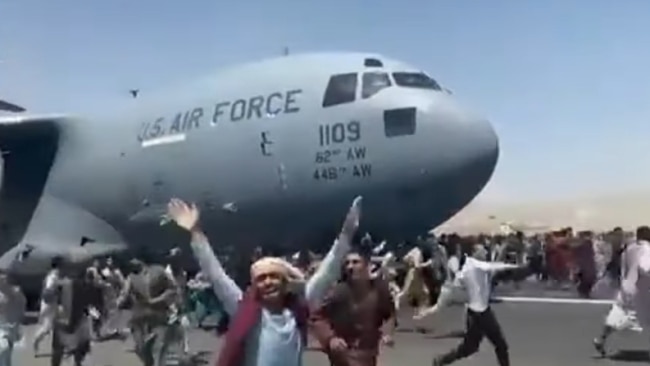 Thousands of Afghans flooded onto Kabul Airport's tarmac and runways in a desperate bid to flee the Taliban-seized country.