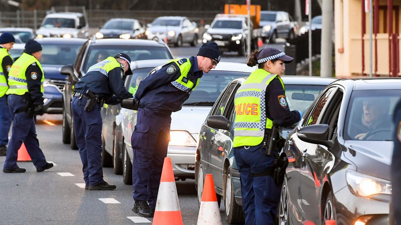 Police in the southern NSW border city of Albury check cars crossing the state border from Victoria on July 8, 2020. Picture: William West/AFP