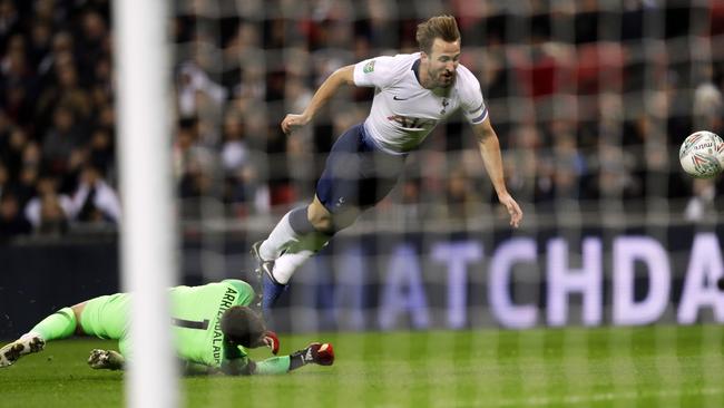 Tottenham's Harry Kane falls as he rounds Chelsea's goalkeeper Kepa Arrizabalaga in an incident that let to a penalty for Spurs. Picture: AP