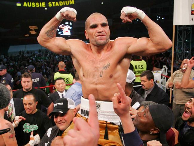 Mundine celebrates victory over Danny Green at Aussie Stadium in 2006.