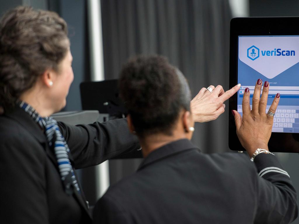 Airline gate agents sign into facial recognition verification system VeriScan at Dulles International Airport in Dulles, Virginia, in 2018. Picture: Jim Watson/AFP