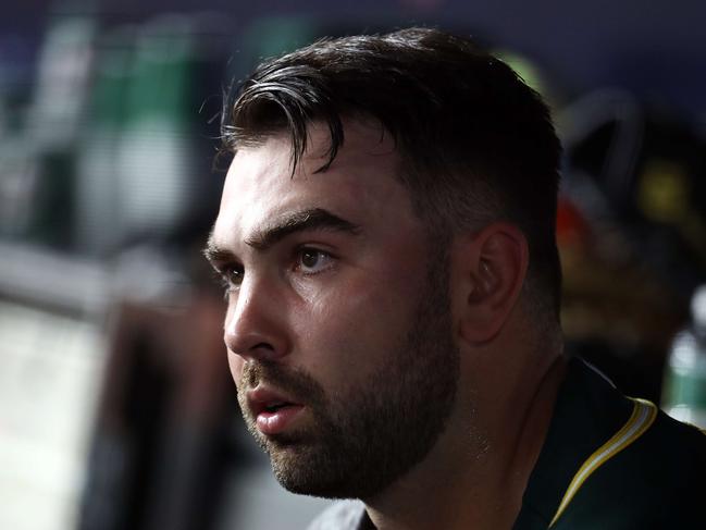 NEW YORK, NEW YORK - OCTOBER 03: Liam Hendriks #16 of the Oakland Athletics sits in the dugout against the New York Yankees during the American League Wild Card Game at Yankee Stadium on October 03, 2018 in the Bronx borough of New York City.   Al Bello/Getty Images/AFP == FOR NEWSPAPERS, INTERNET, TELCOS & TELEVISION USE ONLY ==