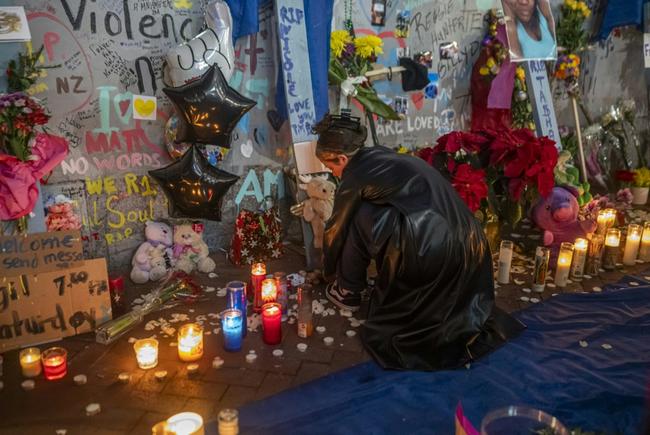 Mourners hold a vigil on Bourbon Street for the 14  victims killed in a January 1, 2025 truck-ramming attack in New Orleans, Louisiana