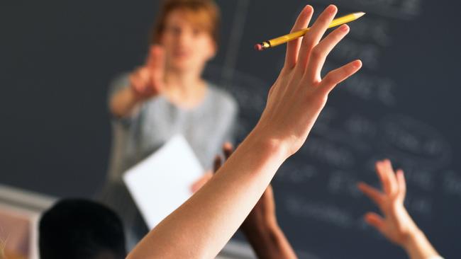 Teacher pointing to raised hands in classroom, Classroom, teaching generic, education generic, Teacher, Learning, Hand Raised, Education, Adult, School Building, Pointing, Standing, Image, Women, Adults Only, Colour Image, Horizontal, Human Arm, Human Body Part, Human Limb, Incidental People, Indoors, Limb, One Person, Only Women, People, Photography, thinkstock, generic, istock