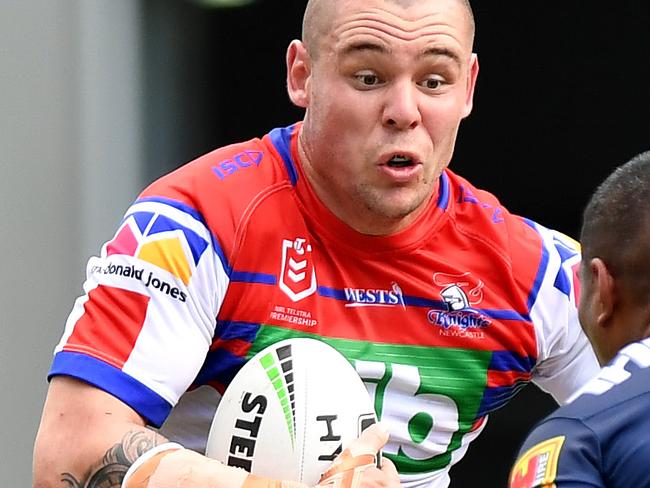 GOLD COAST, AUSTRALIA - APRIL 21: David Klemmer of the Knights takes on the defence during the round 6 NRL match between the Titans and the Knights at Cbus Super Stadium on April 21, 2019 in Gold Coast, Australia. (Photo by Bradley Kanaris/Getty Images)