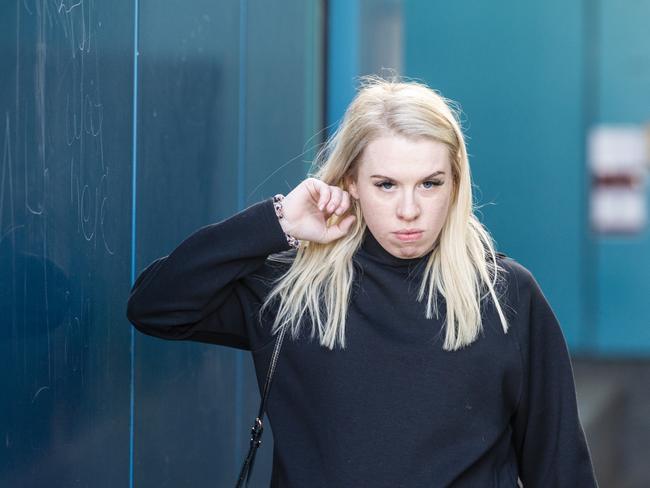 Isobel Rose Higgins, 24, leaves the Toowoomba Watch House after being charged with being an accessory after the fact of murder of Thor Morgan, Thursday, August 18, 2022.