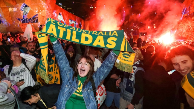 Matildas fans light flares at Federation Square after win