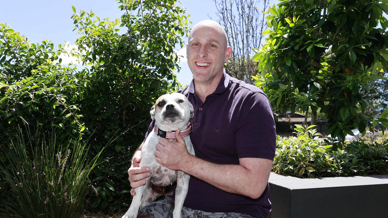 Damian Wolf, with his dog Sharon, has just moved to Parramatta but wants to relocate to Brisbane down the track. Picture: Tim Hunter