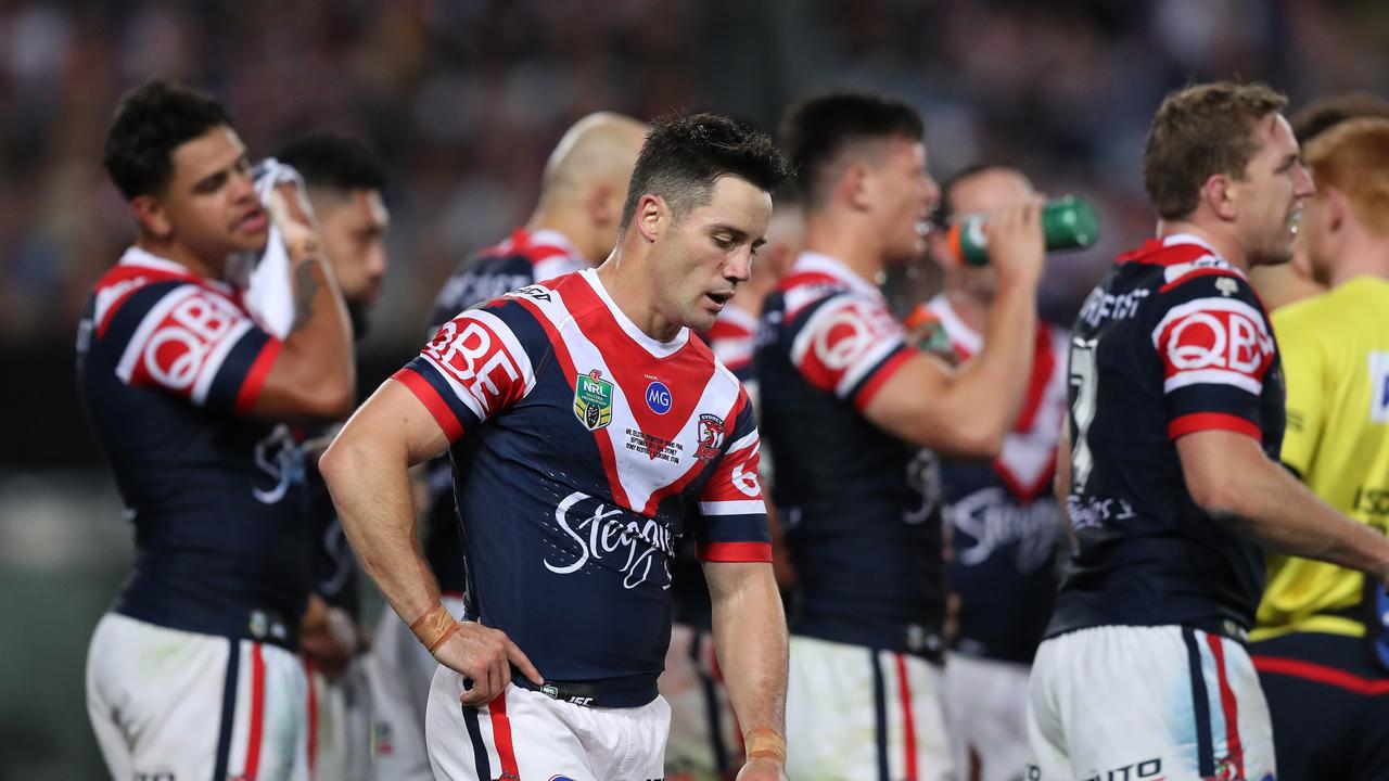 Cronk battled through the grand final with a serious injury. Picture by Brett Costello.