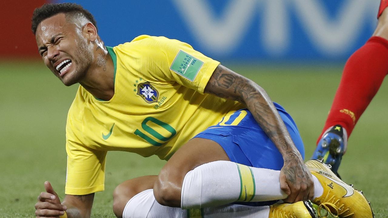 Brazil's Neymar holds his leg during the World Cup in Russia