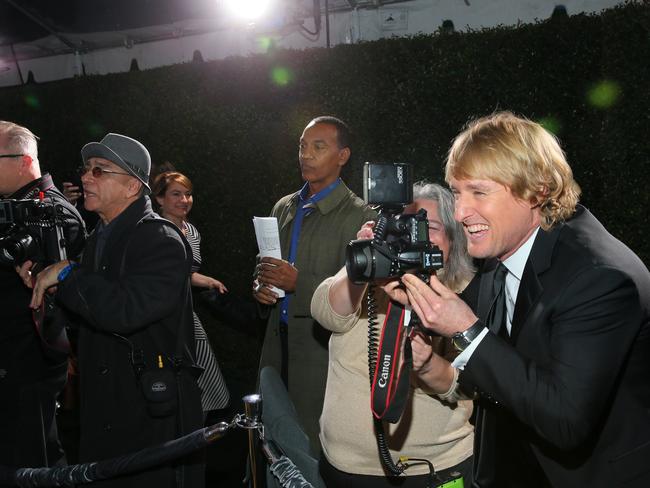 Considering a career change? Owen Wilson goofs around with the paps.