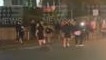 A large crowd pictured on the road outside the McDonald's at Christine Ave in Robina on Saturday May 6 as police conducted an operation targeting hoons in the area. Picture: Nine Gold Coast News