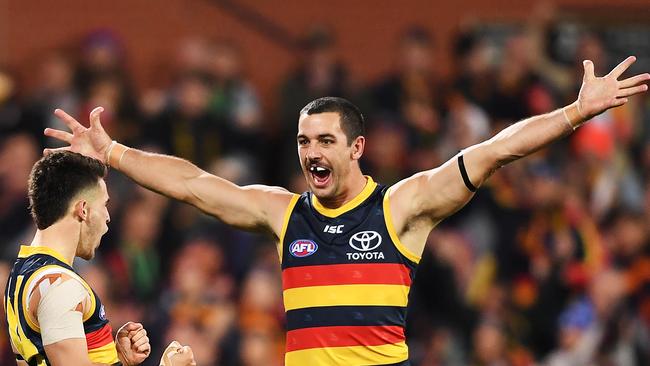 Lachlan Murphy celebrates a last-term goal with skipper Taylor Walker. Picture: Mark Brake/Getty Images