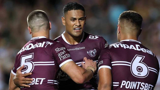 Haumole Olakau'atu of the Sea Eagles celebrates with team mates. Photo by Cameron Spencer/Getty Images.