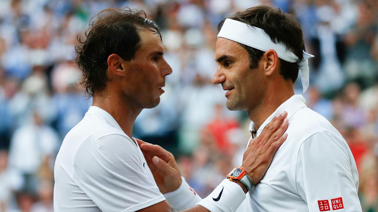 Roger Federer and Rafael Nadal embrace after their semi-final at Wimbledon earlier this year.