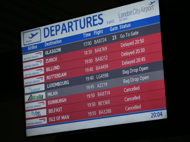 The departure board shows flights cancelled and delayed at London's City Airport after the evacuation. Picture: Daniel Leal-Olivas.