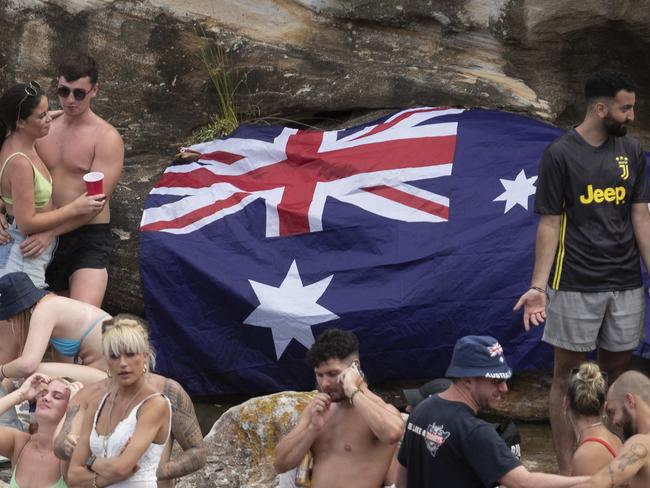 SYDNEY, AUSTRALIA - JANUARY 26: A large crowd gathers in Gordons Bay in SydneyÃ¢â¬â¢s East as temperatures soar on January 26, 2021 in Sydney, Australia.  Australia Day, formerly known as Foundation Day, is the official national day of Australia and is celebrated annually on January 26 to commemorate the arrival of the First Fleet to Sydney in 1788. Indigenous Australians refer to the day as 'Invasion Day' and there is growing support to change the date to one which can be celebrated by all Australians. (Photo by Brook Mitchell/Getty Images)