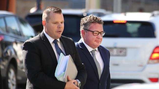 Shane Gibbs (right), a former SAS soldier, arrives for sentencing at Southport Court with David Garratt of Howden Saggers lawyers. Picture Glenn Hampson.