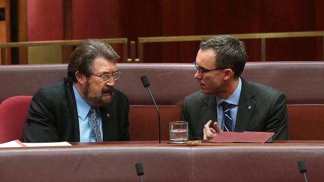 Senator Derryn Hinch and Senator Tim Storer talking in the Senate Chamber at Parliament House in Canberra. Picture: Kym Smith