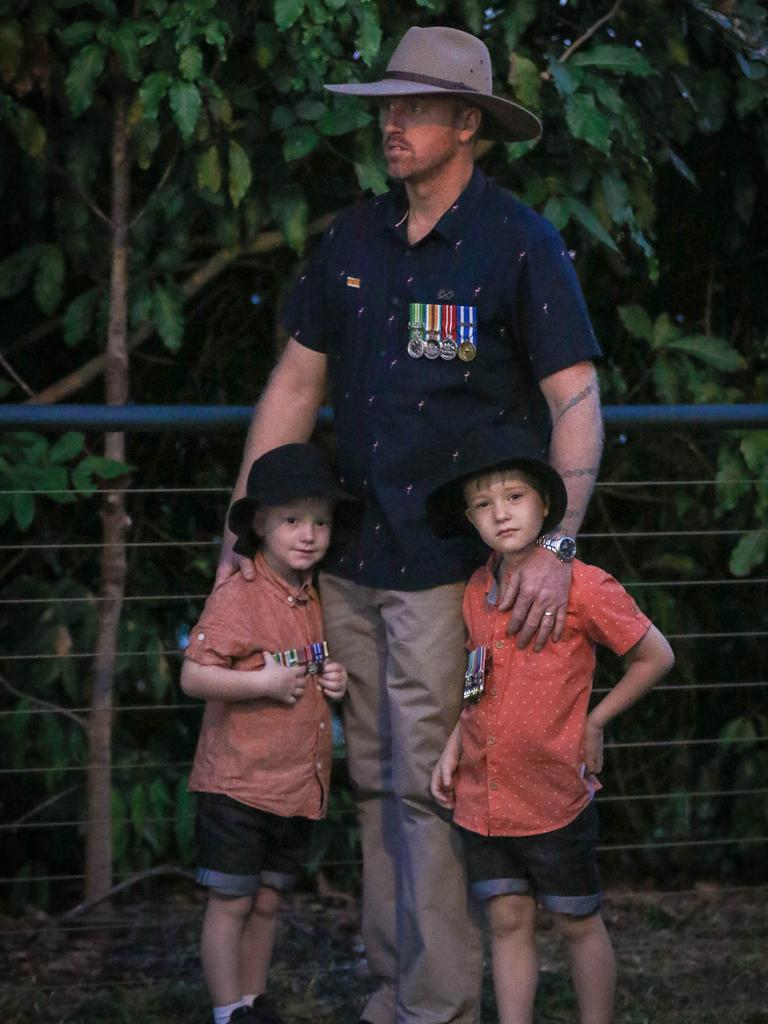 Brad Ford with his sons Oscar (R) and Huxlee at The Dawn Service at Darwins Cenotaph commemorating ANZAC Day 2021. Picture Glenn Campbell