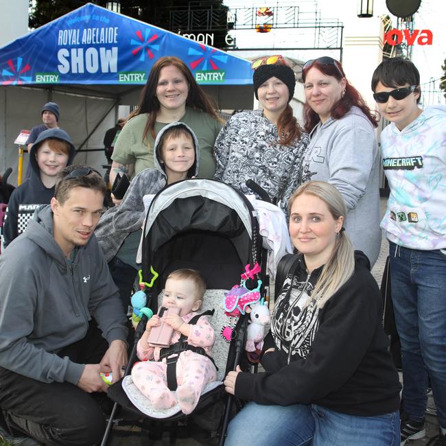 Nicole Walters with partner Lee Thompson and 10-month-old daughter Adeline, with Blaze, 7, Mahalia, Seth, 8, Olivia, Leigh Walters, and Dimitri, 12. Picture: Dean Martin