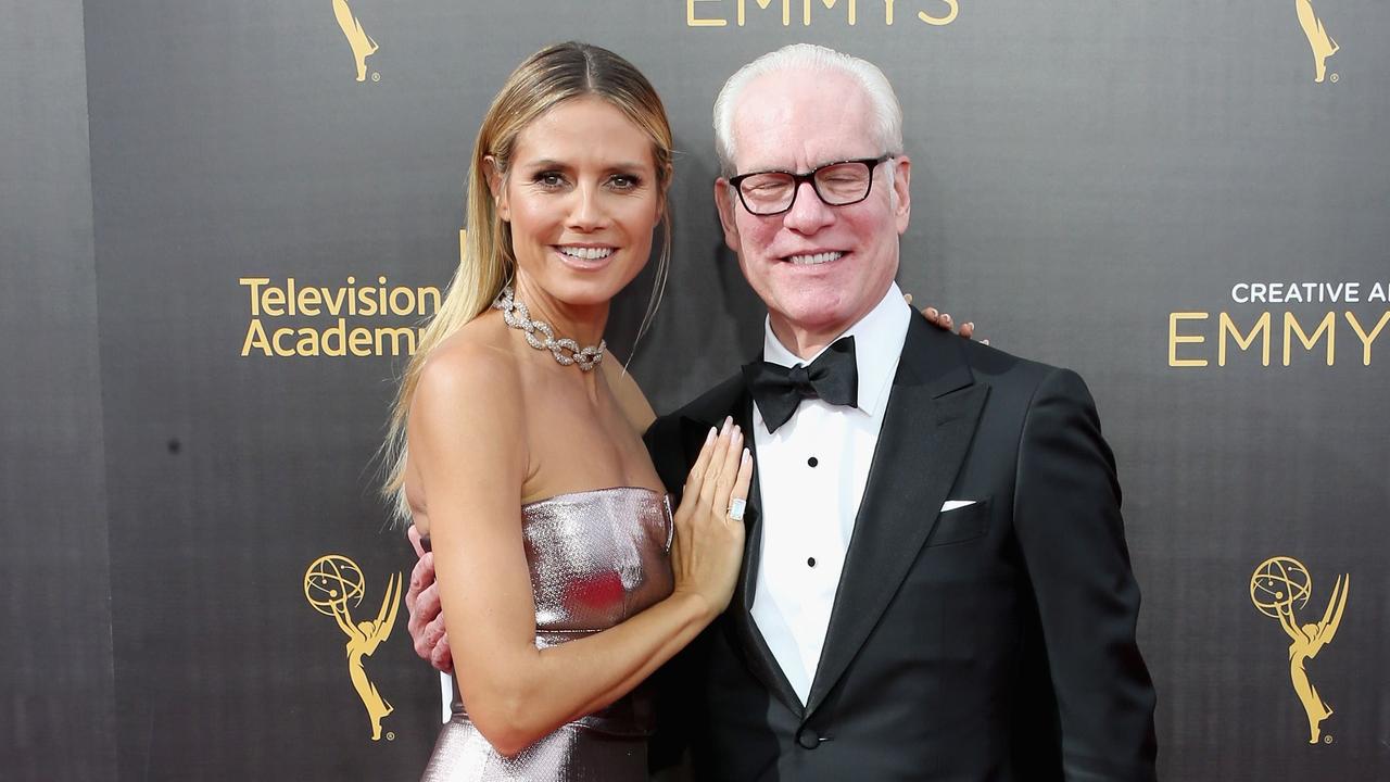 A not so flattering photo of Tim Gunn with Heidi Klum.