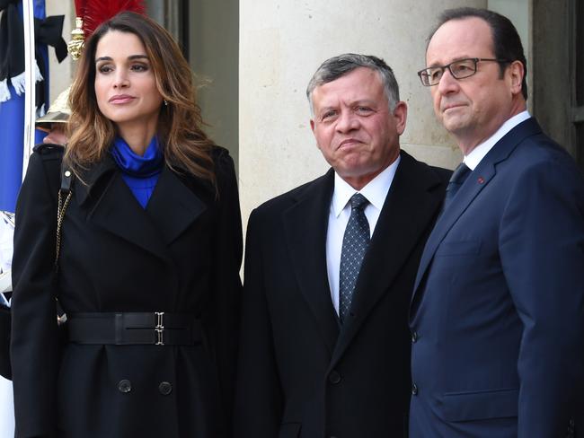 Welcome ... French President Francois Hollande welcomes Jordanian King Abdullah II and Queen Rania at the Elysee Palace. Picture: Dominique Faget/AFP