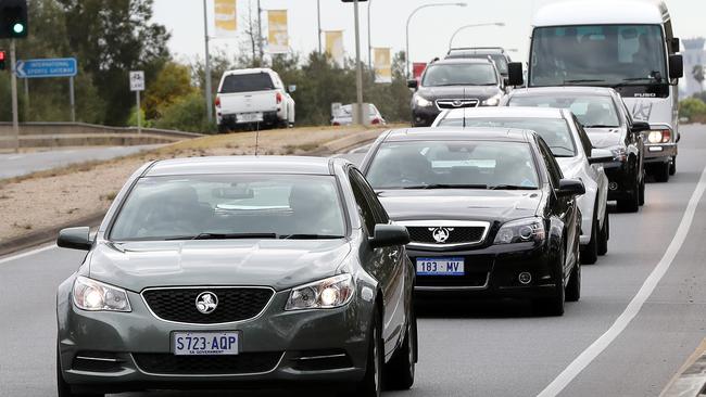 The Chinese delegation travels down Sir Donald Bradman Drive after arriving in Adelaide. Pic: Calum Robertson