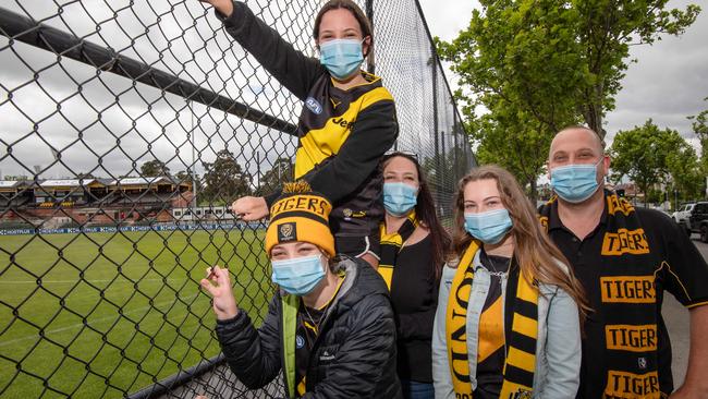 The Lowther family have come from Eltham to see an empty Punt Road oval. Picture: Jason Edwards