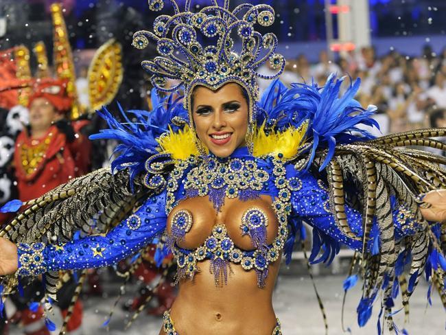 A reveller of the Gavioes da Fiel samba school performs at the Sambadrome in Sao Paulo, Brazil. Rio’s Samba schools are about to start their annual dance off.