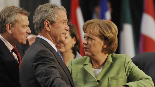 NATO Secretary-general Jaap de Hoop Scheffer, US President George W. Bush and German Chancellor Angela Merkel talk during the 2008 NATO meeting in Bucharest. Picture: AFP