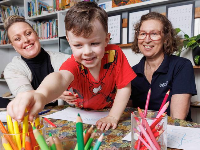 (File image) Sophie Topeross (left) and her son Hugo, 4 pictured with Su Garrett Director of the childcare centre Explore and Develop Annandale. Picture: David Swift