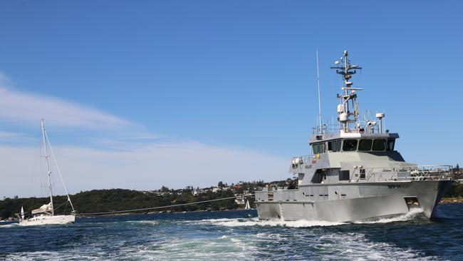 NSW Police tow the La Fayette into Sydney Harbour. Picture: NSW Police