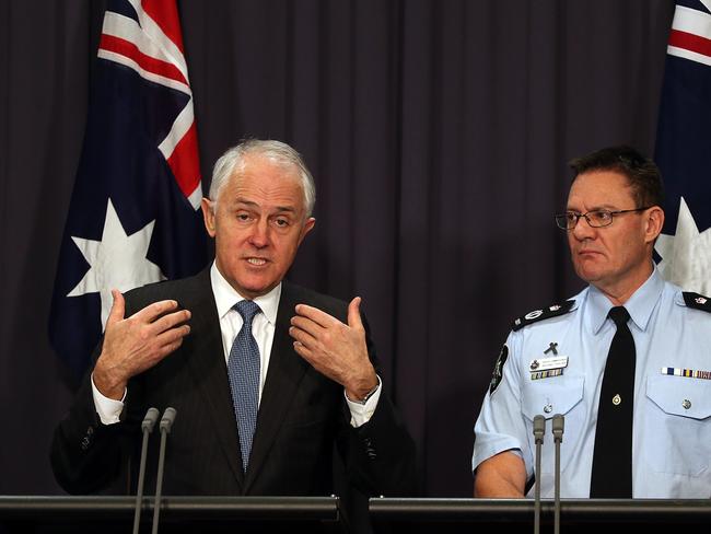 PM Malcolm Turnbull, pictured with Acting AFP Commissioner Michael Phelan, says a review is currently underway into espionage laws and foreign donations. Picture Kym Smith