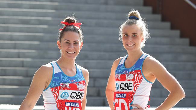 Abbey McCulloch, in her playing days with the Swifts, and defender Maddy Turner.