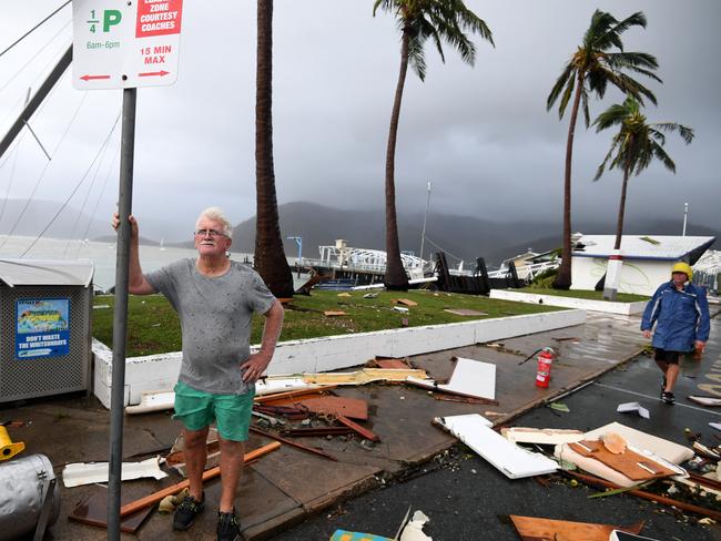 Local council worker Brian Doyle inspects damage at Shute Harbour, Airlie Beach. Picture: Dan Peled/AAP