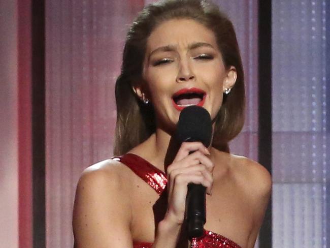 Host Gigi Hadid impersonates Melania Trump at the American Music Awards at the Microsoft Theater on Sunday, Nov. 20, 2016, in Los Angeles. (Photo by Matt Sayles/Invision/AP)