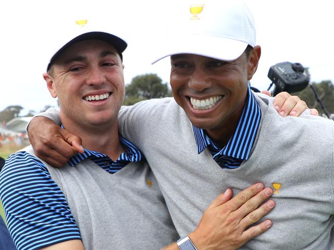 MELBOURNE, AUSTRALIA - DECEMBER 13:  Playing Captain Tiger Woods of the United States team and Justin Thomas of the United States team celebrate defeating Byeong-Hun An of South Korea and the International team and Hideki Matsuyama of Japan and the International team 1up on the 18th green during day two of the 2019 Presidents Cup at  Royal Melbourne Golf Course on December 13, 2019 in Melbourne, Australia. (Photo by Warren Little/Getty Images)