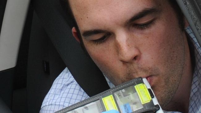 A motorist undergoes a random breath test. Picture: AAP Image/Julian Smith