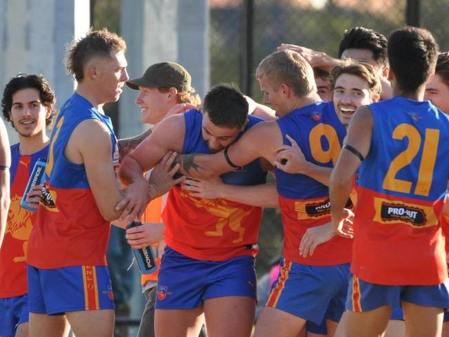 EFNL 2024: Mulgrave players get around debutant Sam Carter. Picture: Rhonda Tilyard and Craig Bonney