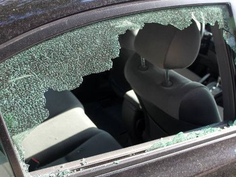 smashed car window for web. Police warning generic crime theft car