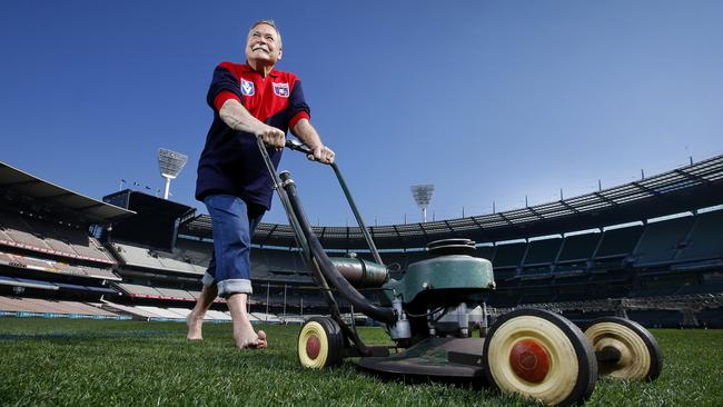 Living footy legend Ron Barassi was snapped trimming the turf at the MCG. The ground is better known to the decorated former player and coach as his ‘back yard’. Picture: David Caird