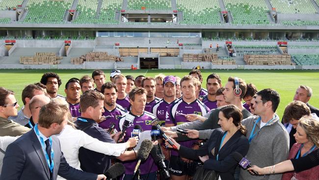 Craig Bellamy faces the media scrum.