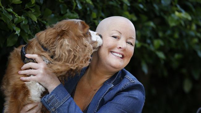 Melbourne woman Tracey Keogh with her dog Calvie, knows first-hand just how effective Kisqali can be. Picture: David Caird