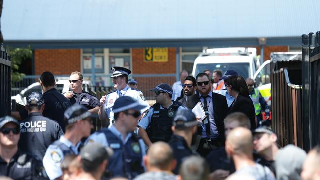 Parents and emergency services at Banksia Road Public School at Greenacre where a car has slammed into a classroom, killing two and injuring others.