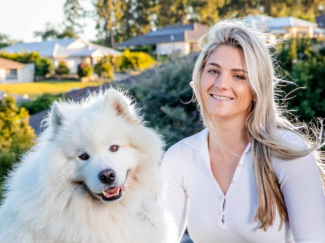 Bridget Carkeet with Frankie the Samoyed outside her Karalee home, Tuesday, June 28, 2022 - Picture: Richard Walker