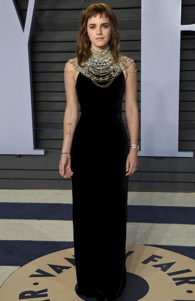 Emma Watson arrives at the Vanity Fair Oscar Party with a new tattoo on her arm. Picture: Evan Agostini/Invision/AP.