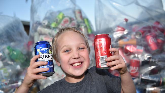 Caboolture’s Reegan Pellowe collecting cans and bottles to raise money for sick children, when he was nine years old. Photo: Luke Simmonds